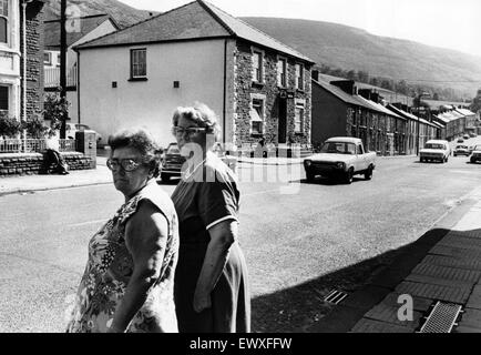 Mrs Mary Sykes (left) and Mrs Gwen Baker of Treorchy, pictured at the spot in High St. Treorchy near the Red Cow public house (pictured rear) where residents want a crossing on the busy main road. August 1977. Stock Photo
