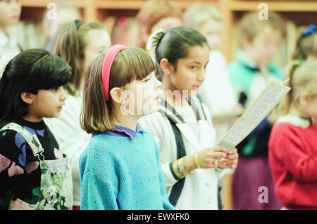 Children from Abingdon Junior School caused quite a stir when they sang Christmas Carols at Middlesbrough Central Library, 9th December 1992. Stock Photo