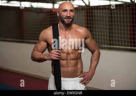 Portrait Of A Man In Kimono With Black Belt On Shoulder Stock Photo