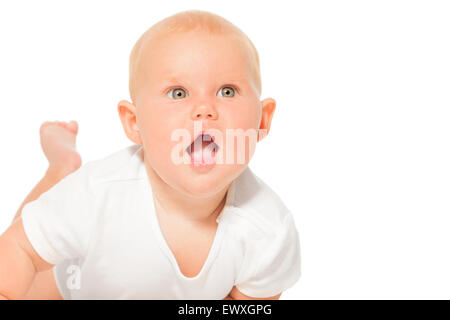 Portrait of baby with open mouth in white bodysuit Stock Photo