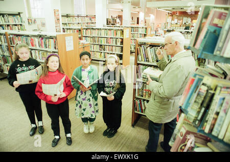 Children from Abingdon Junior School caused quite a stir when they sang Christmas Carols at Middlesbrough Central Library, 9th December 1992. Stock Photo