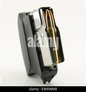 bullets of hunting rifle and charger on white background Stock Photo