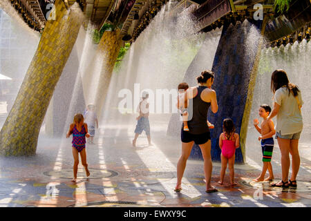 Children play at Thunder park, a splash park in downtown Oklahoma City, Oklahoma at the Myriad Botanical Gardens.  USA. Stock Photo