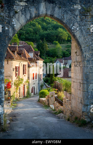 Sunset at old entry gate to Saint-Cirq-Lapopie, Lot Valley, Midi-Pyrenees, France Stock Photo