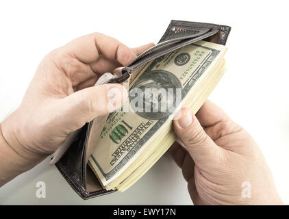Opening the wallet full of money. Stock Photo