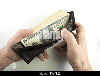 Opening the wallet full of money. Stock Photo