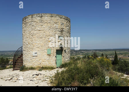 Windmill on the Roc de Gachone near Calvisson, France. The mill overlooks the Vaunage Plain. Stock Photo