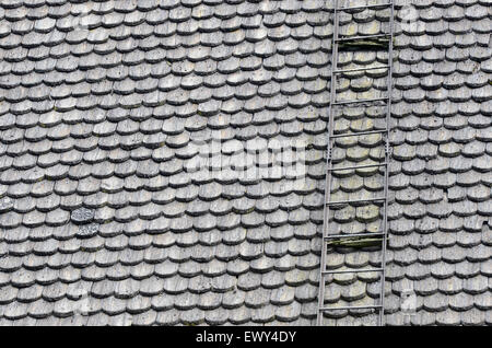 church roof covered with wooden shingles and stairs Stock Photo