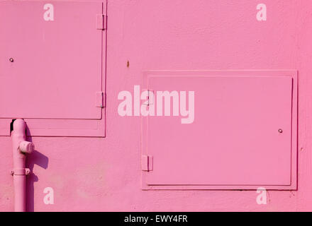 Gas and electric cupboards painted bright pink on a Burano house Venetian Lagoon Veneto Italy Europe