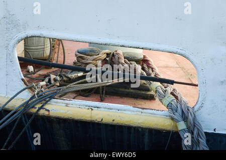 the boat is mooring with rope in the harbour Stock Photo