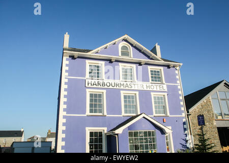 The former harbourmaster's house now the cobalt-blue boutique hotel 'The Harbourmaster Hotel' at the far end of Quay Parade over Stock Photo