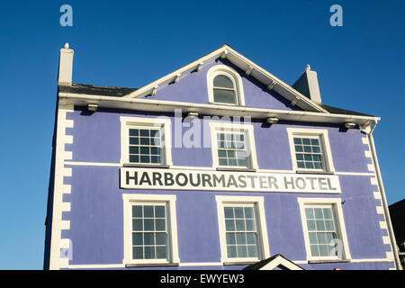 The former harbourmaster's house now the cobalt-blue boutique hotel 'The Harbourmaster Hotel' at the far end of Quay Parade over Stock Photo