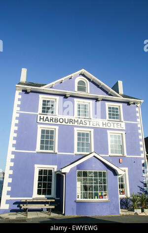 The former harbourmaster's house now the cobalt-blue boutique hotel 'The Harbourmaster Hotel' at the far end of Quay Parade over Stock Photo