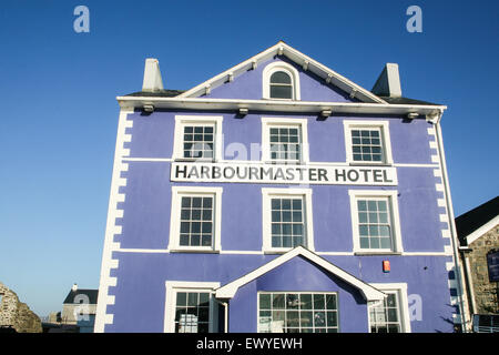 The former harbourmaster's house now the cobalt-blue boutique hotel 'The Harbourmaster Hotel' at the far end of Quay Parade over Stock Photo