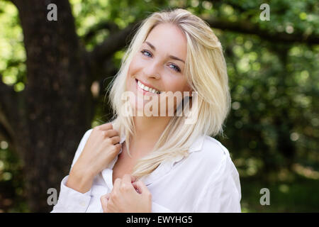Portrait of a young blonde haired woman smiling