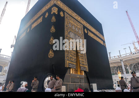 MECCA - MARCH 14, 2015 : A close up view of kaaba door and the kiswah (cloth that covers the kaaba) at Masjidil Haram. Stock Photo