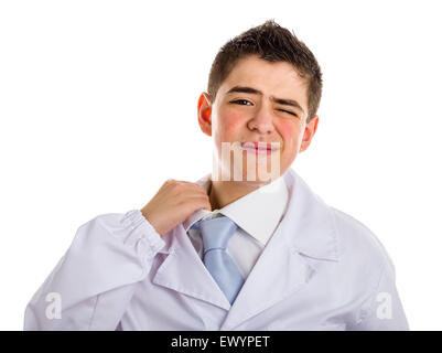 A boy doctor in blue tie and white coat pulling his collar with finger because uncomfortable. His acne skin has not ben retouched Stock Photo