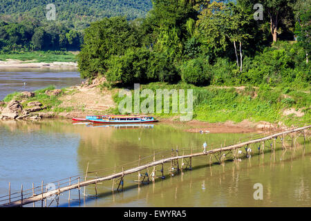 Footbridge across Nam Khan river, Luang Prabang, Laos Stock Photo