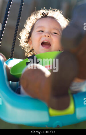 Little girl on swing Stock Photo