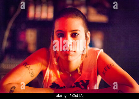 Portrait of punk girl, resting on arms Stock Photo