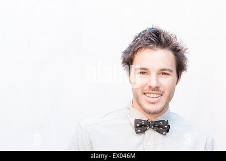 Portrait of young man wearing bow tie Stock Photo