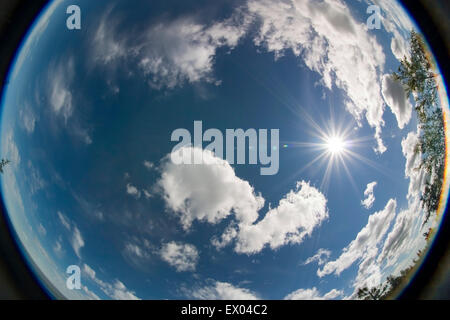 cumulus clouds and the sun Stock Photo