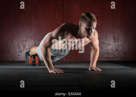 Man doing push-ups Stock Photo