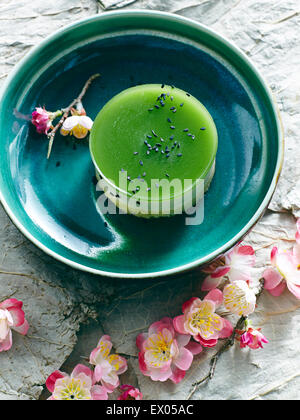 Still life with bowl of Japanese green tea cheesecake Stock Photo