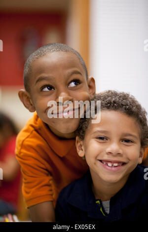 Boys smiling in classroom Stock Photo