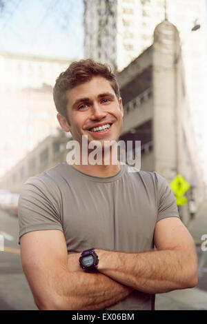 Portrait of young male runner on street, Pioneer Square, Seattle, USA Stock Photo