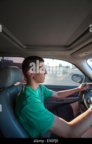 A teenager practicing for his drivers test Stock Photo