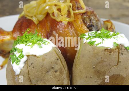 appetizing baked knuckles of pork on plate Stock Photo