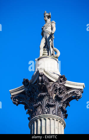 The statue of Admiral Horatio Nelson proudly sitting on top of Nelson’s Column in London. Stock Photo