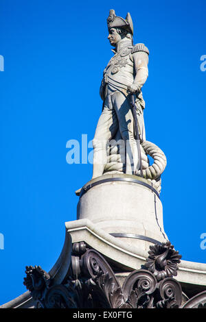 The statue of Admiral Horatio Nelson proudly sitting on top of Nelson’s Column in London. Stock Photo