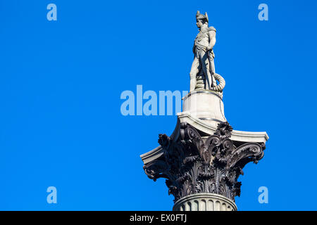 The statue of Admiral Horatio Nelson proudly sitting on top of Nelson’s Column in London. Stock Photo