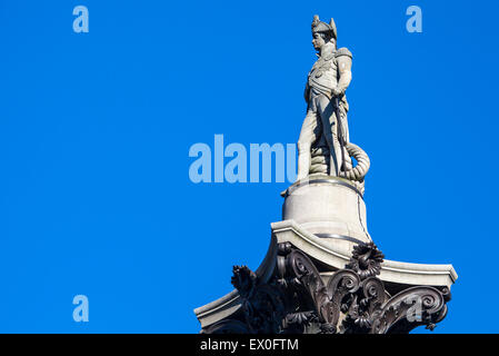 The statue of Admiral Horatio Nelson proudly sitting on top of Nelson’s Column in London. Stock Photo