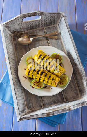 Grilled sweetcorn with lime and chilli flakes Stock Photo