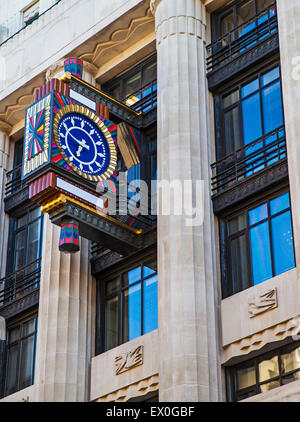 An Art Deco design clock on Peterborugh Court, the head office of Goldman Sachs, in Fleet Street, London. Stock Photo