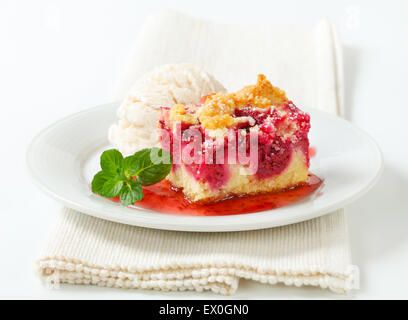 Berry fruit crumble slice with ice cream and raspberry sauce Stock Photo