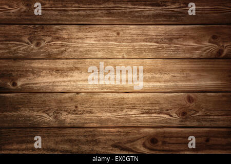 Rustic wood planks background with nice studio lighting and elegant vignetting to draw the attention Stock Photo