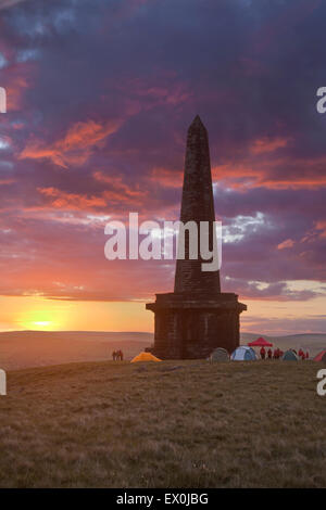 Dramatic colourful sunset seen over Stoodley Pike near Todmorden, Calderdale, West Yorkshire, UK. Stock Photo