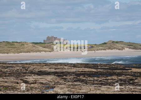 Bamburgh Castle from Seahouses harbour on the Northumberland Coast England Great Britain Stock Photo