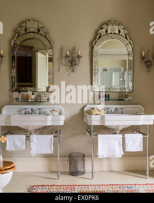 Matching basins from Cesame with glass framed mirrors from Christopher Wray Stock Photo