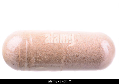 Macro shot of a single pill on a white background Stock Photo