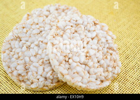 Biscuits with rice on stacked on yellow tablecloth Stock Photo