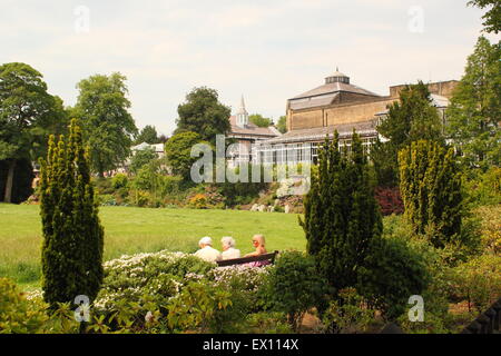 People relax in the PAvilion Gardens in Buxton, Derbyshire England UK Stock Photo