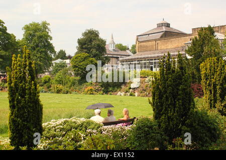 People relax in the PAvilion Gardens in Buxton, Derbyshire England UK Stock Photo