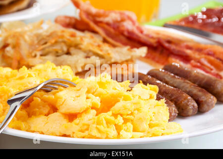 Stock image of hearty breakfast focus on foreground. Stock Photo