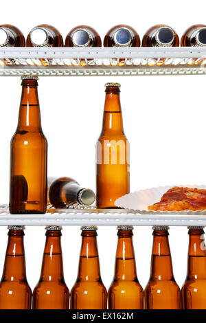 Stock image of interior of a refrigerator full of beers and a slice of pizza Stock Photo