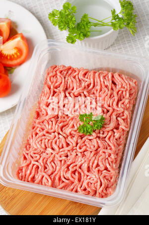 Raw minced meat in plastic container Stock Photo